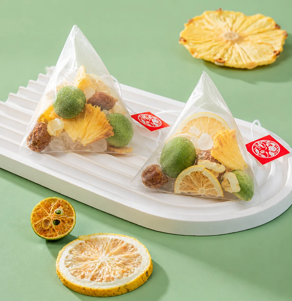 Fruit and herbal tea triangle bags arranged on a plate
