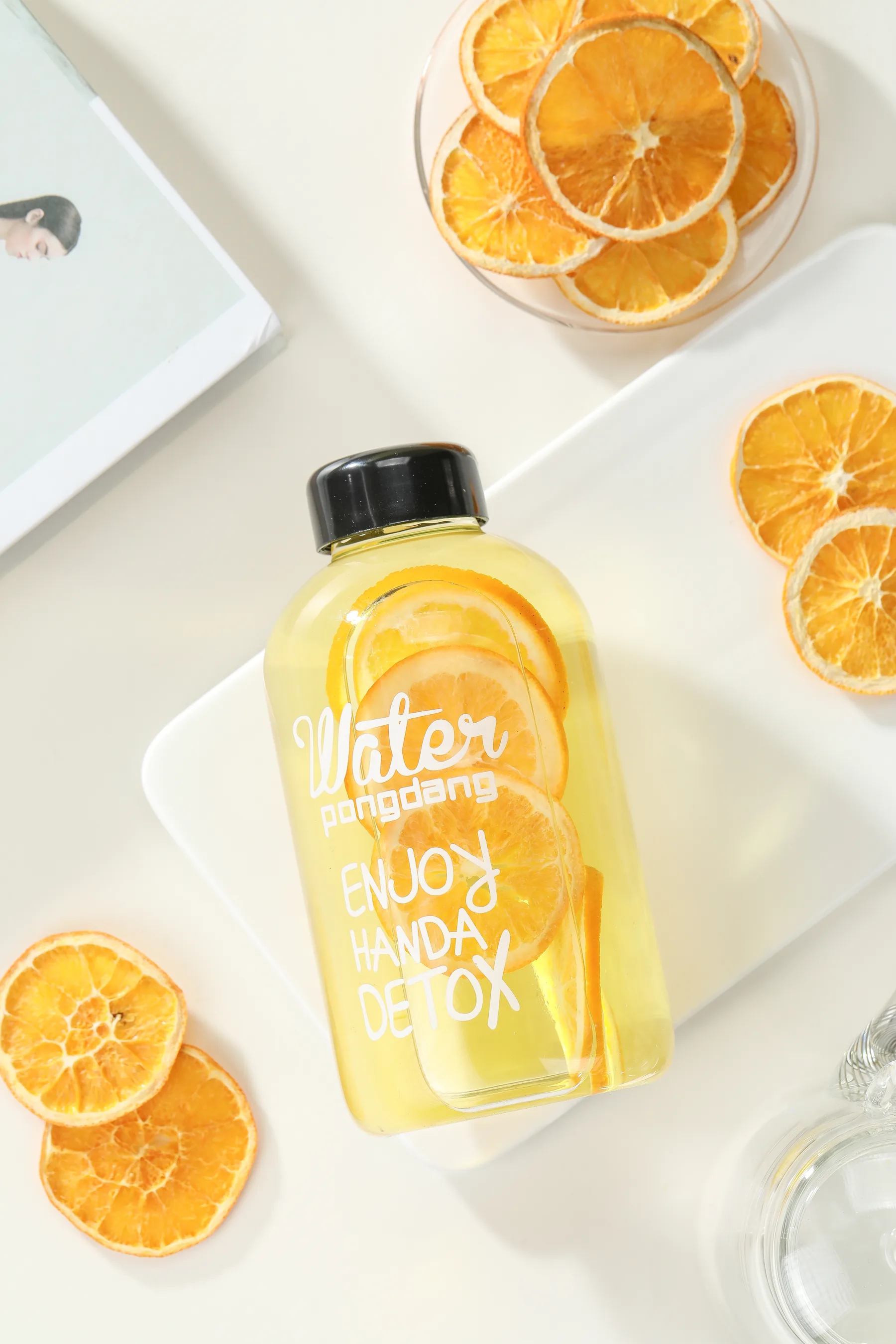 Orange slice fruit tea infusion in a clear glass